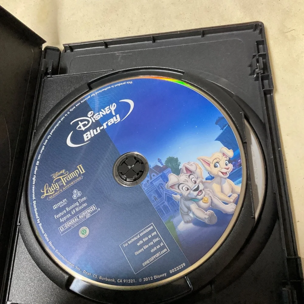 DVD and Blu Ray Disc - Lady and the Tramp II.    V107